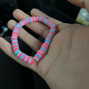 A pink, blue, and hot pink bracelet